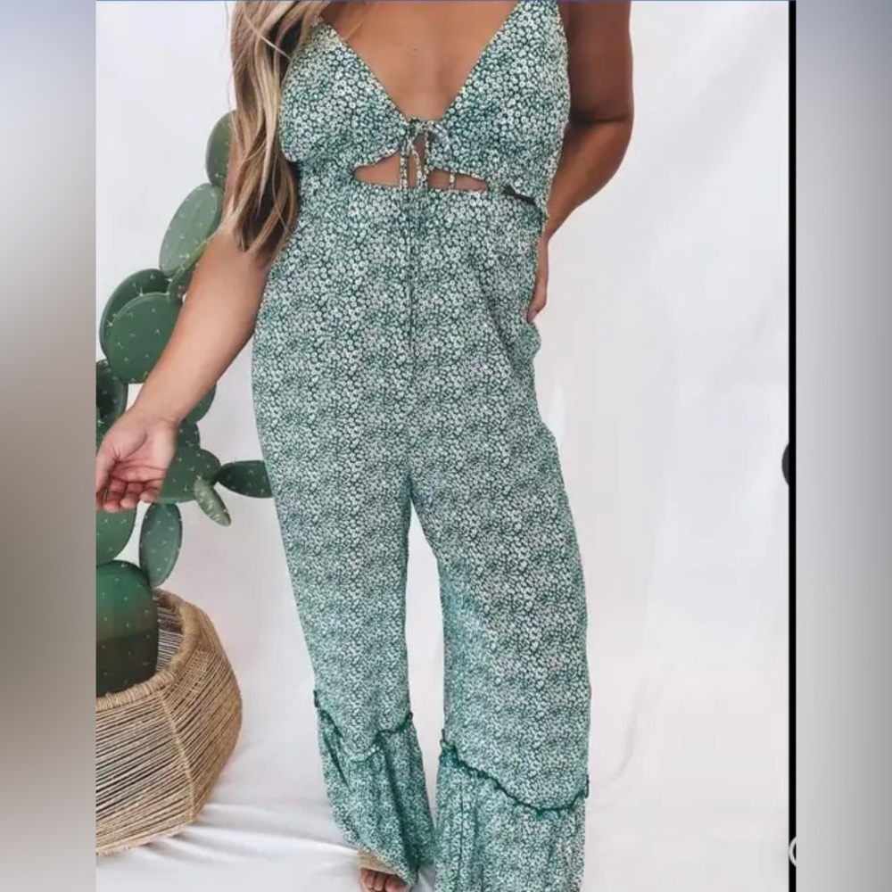 Shop Neighbor by In The Beginning Green floral jumpsuit